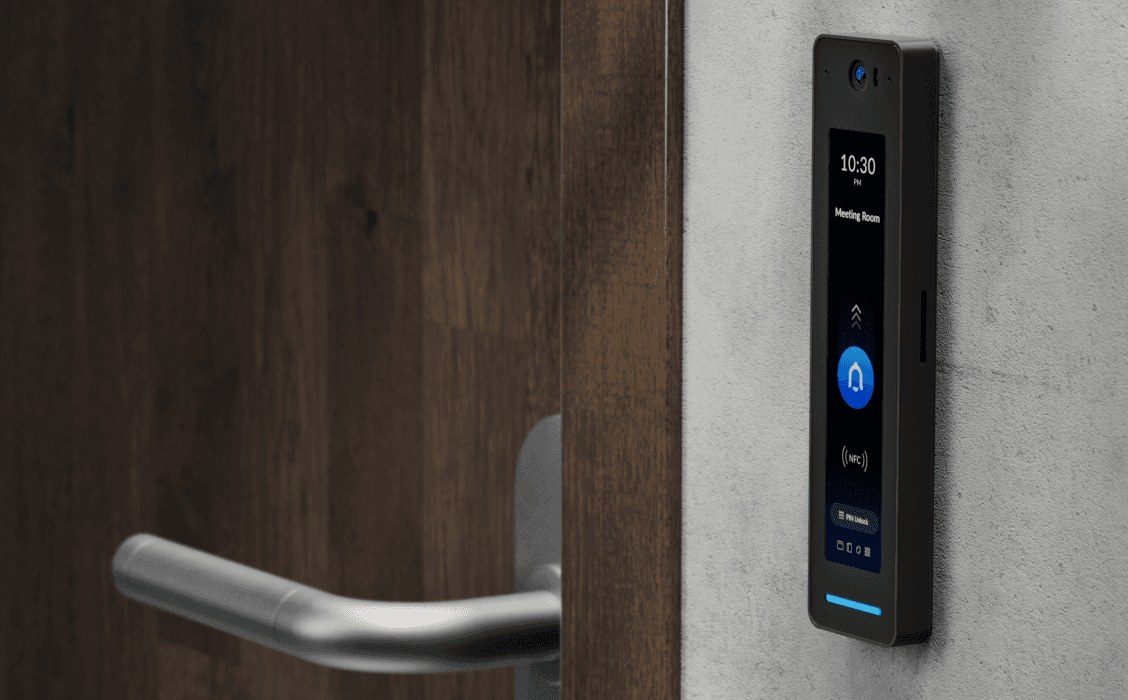 Black UniFi G2 Pro access reader next to a door handle