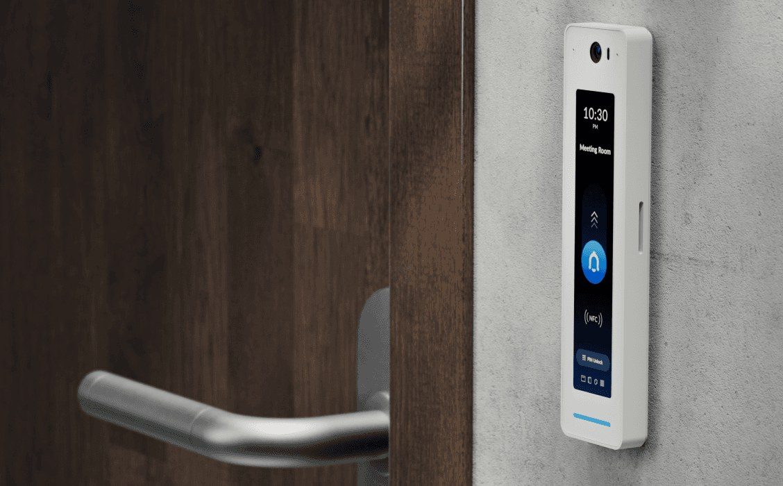 White UniFi G2 Pro access reader mounted beside an office door