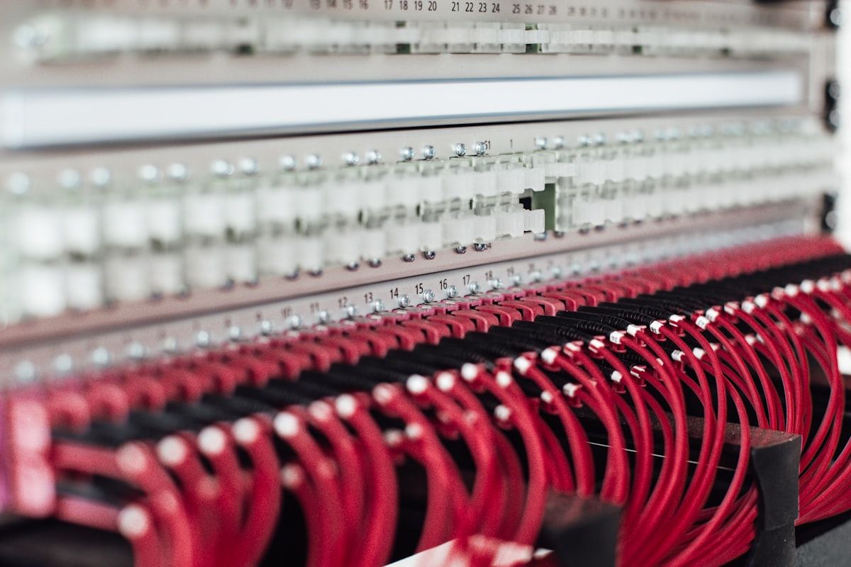 Patch panel with neatly dressed red Cat6A patch cords